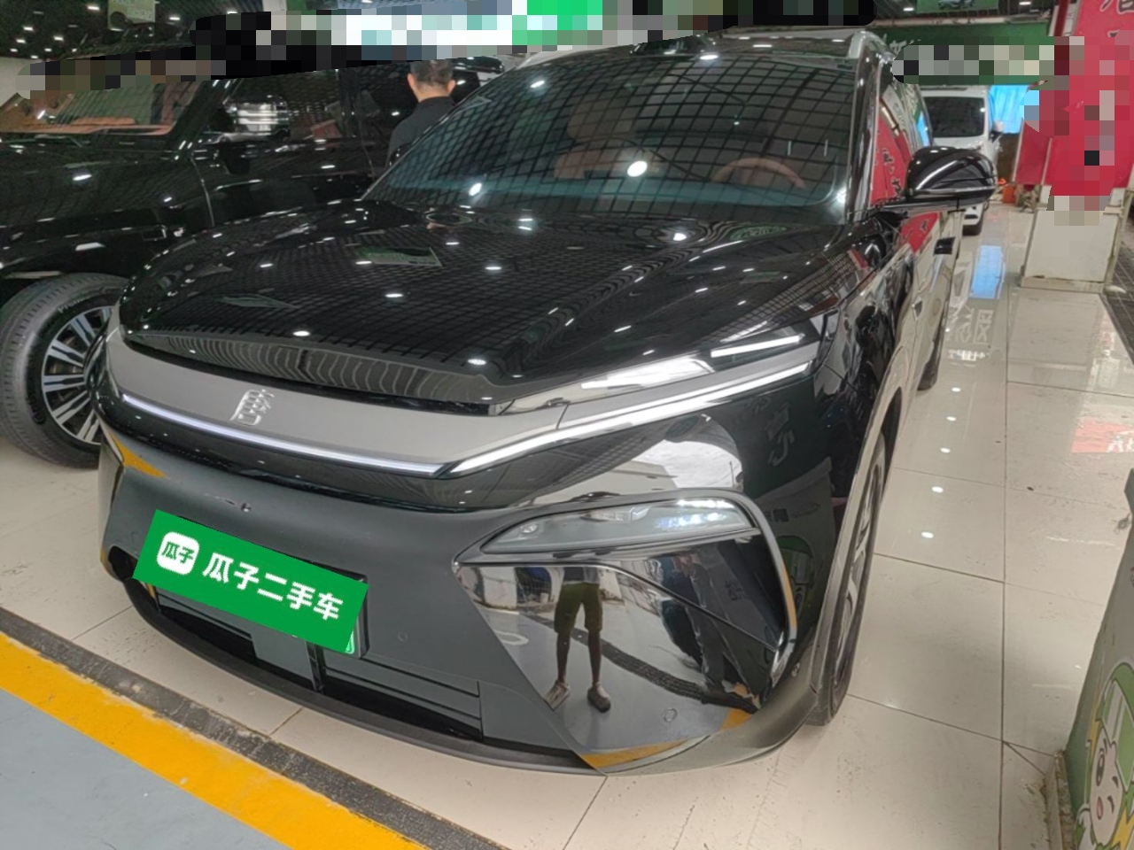 Under the front of the car