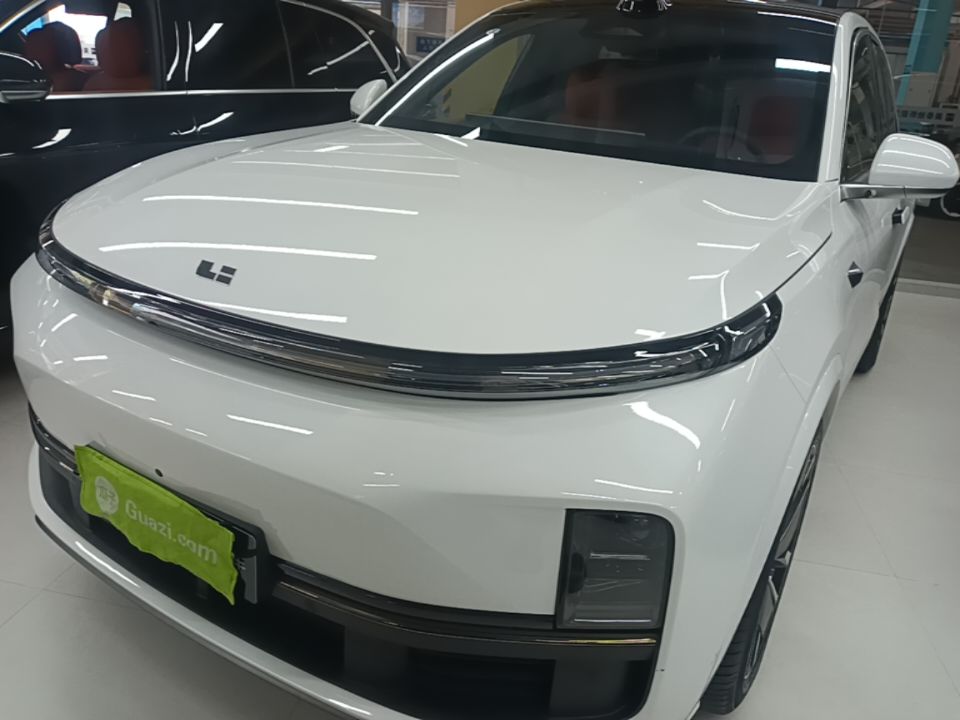 Under the front of the car