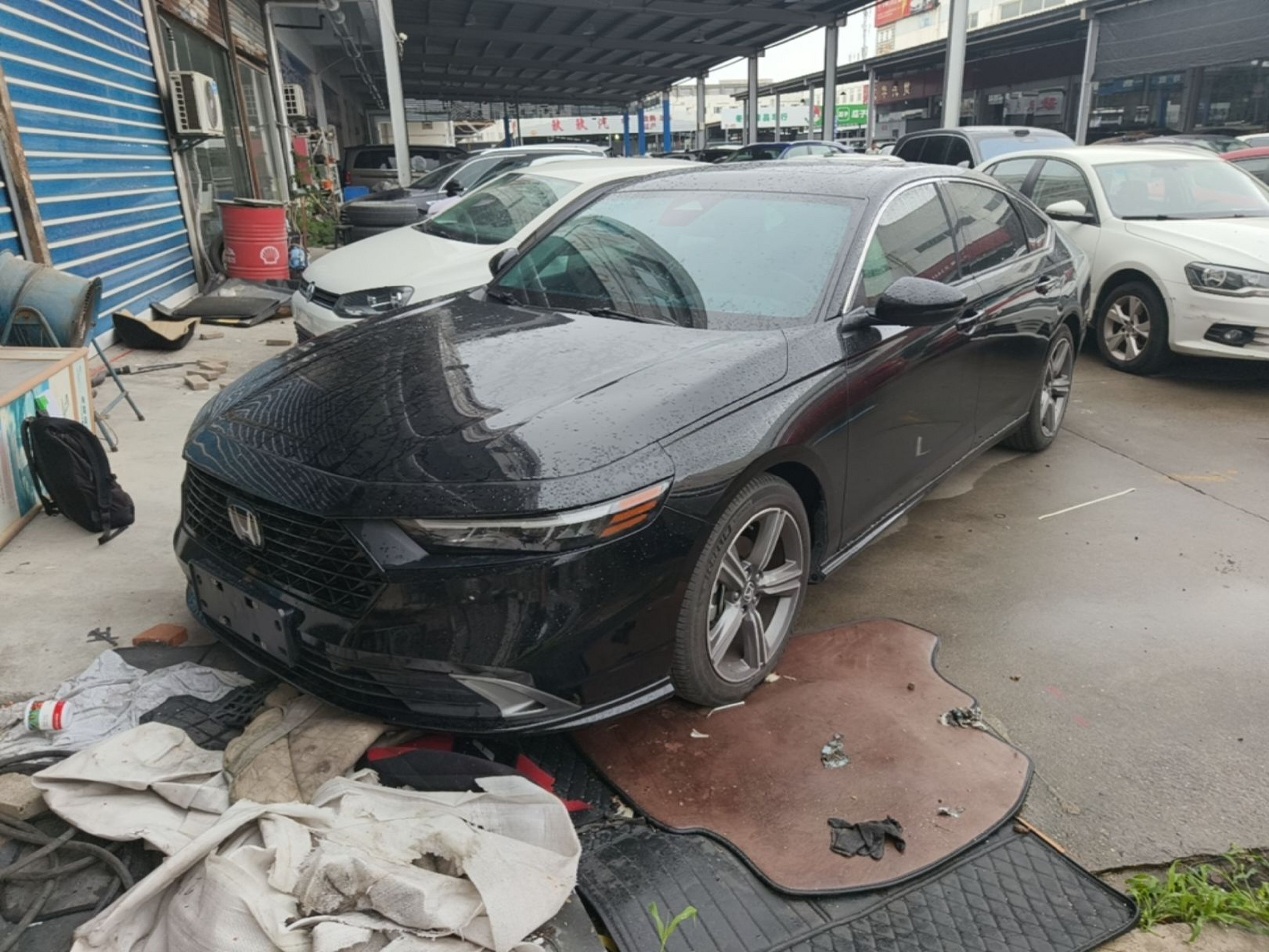 Under the front of the car