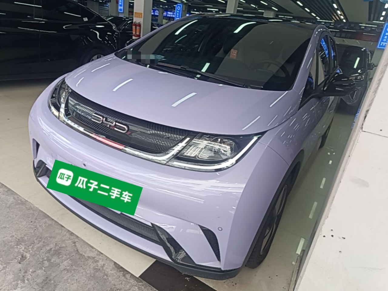 Under the front of the car