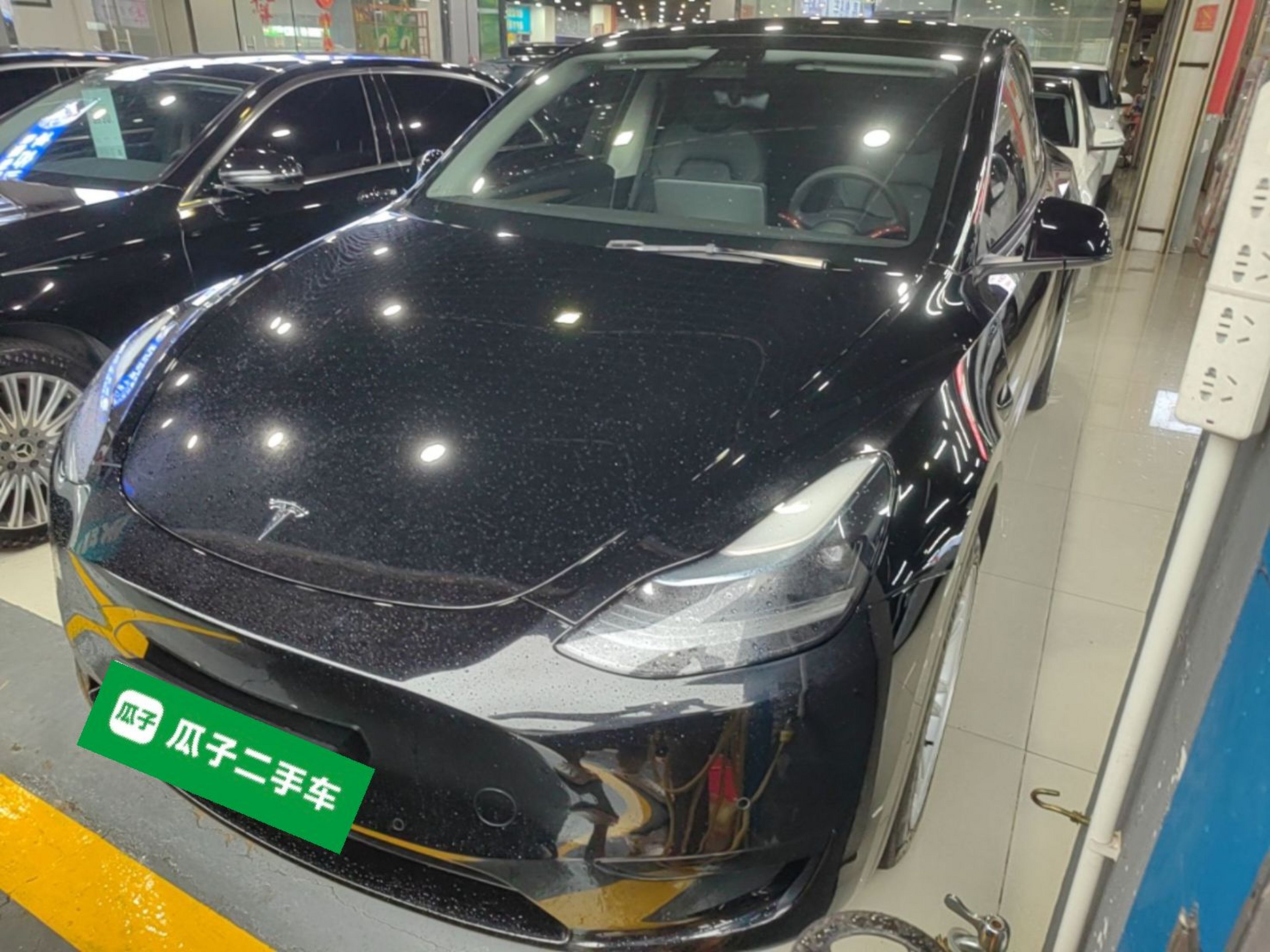 Under the front of the car