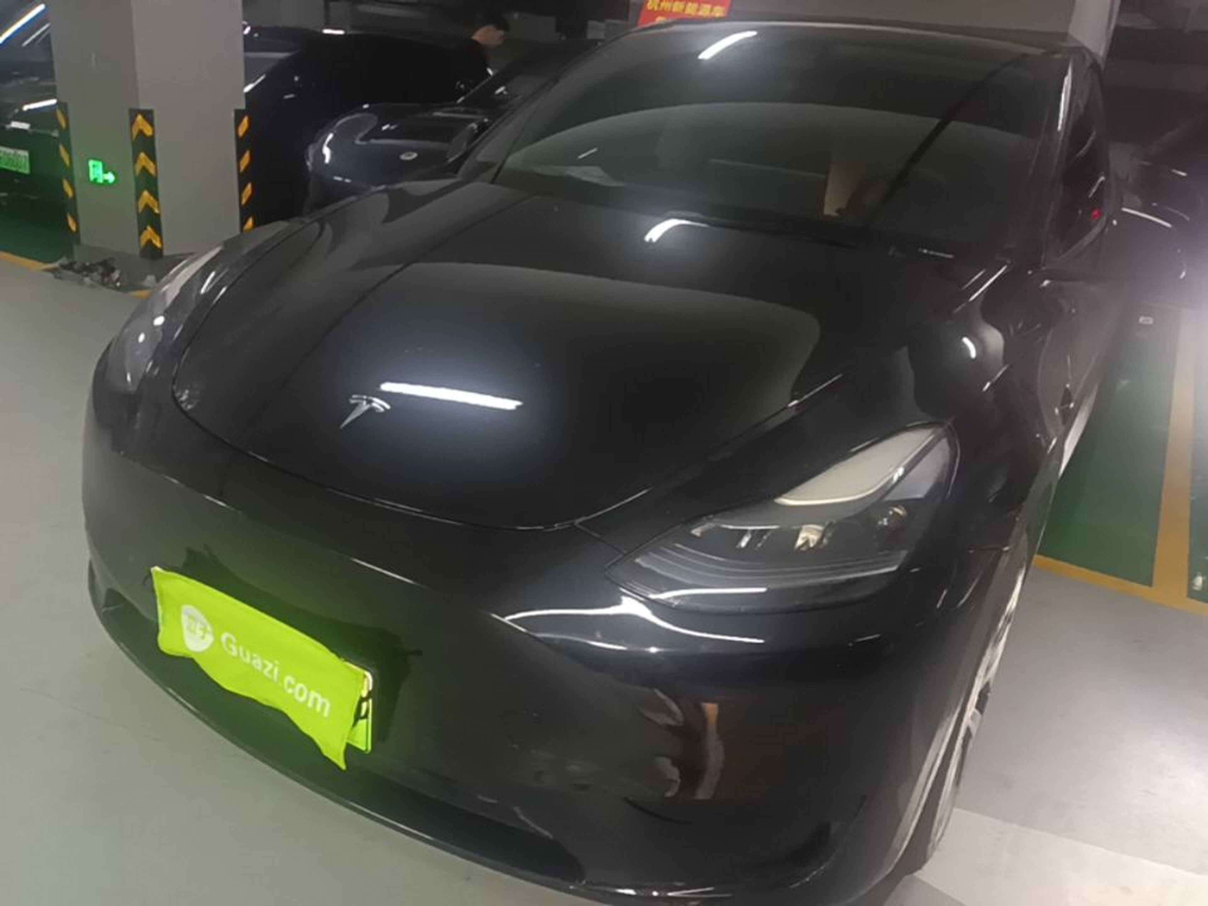 Under the front of the car