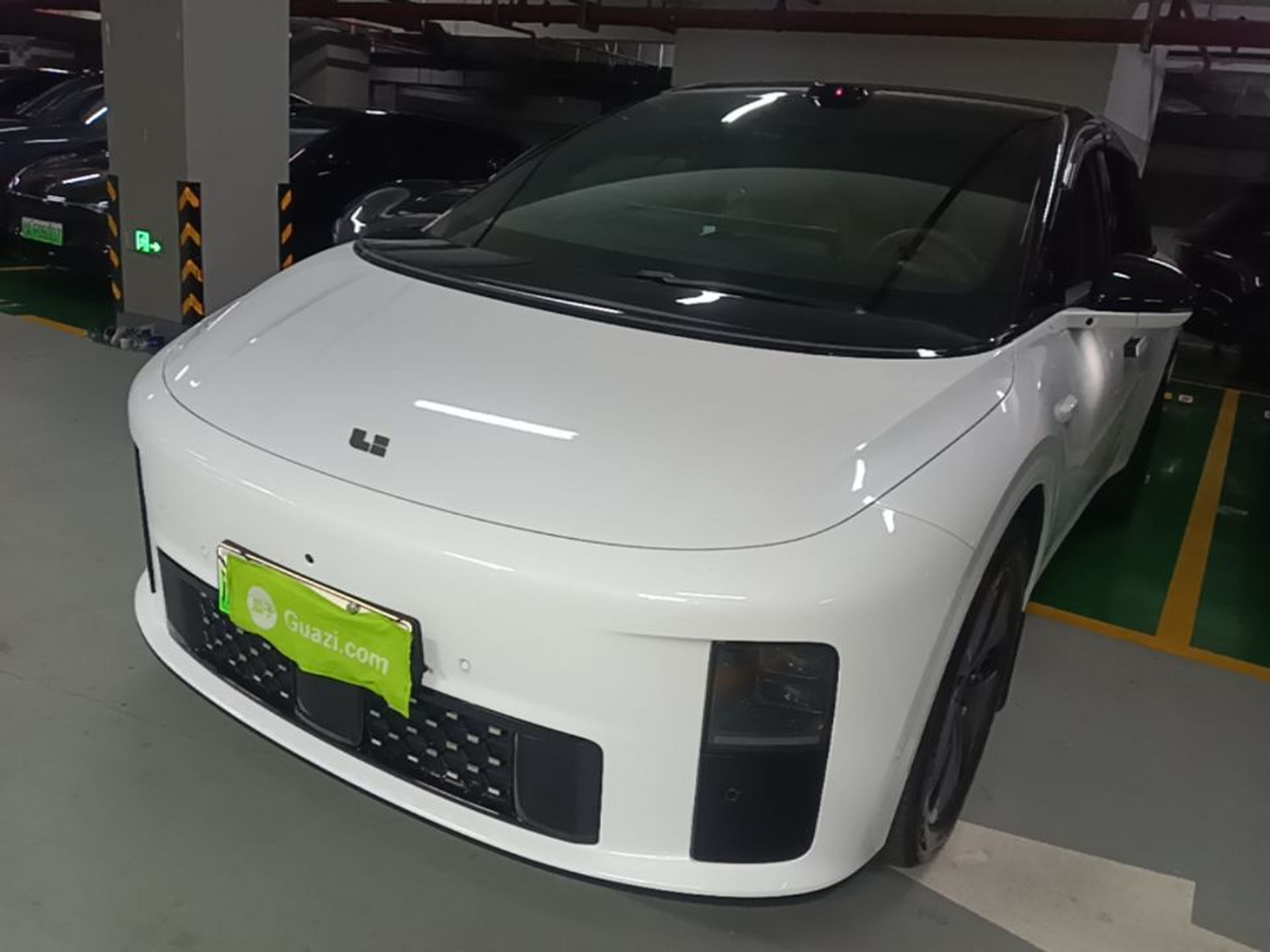 Under the front of the car