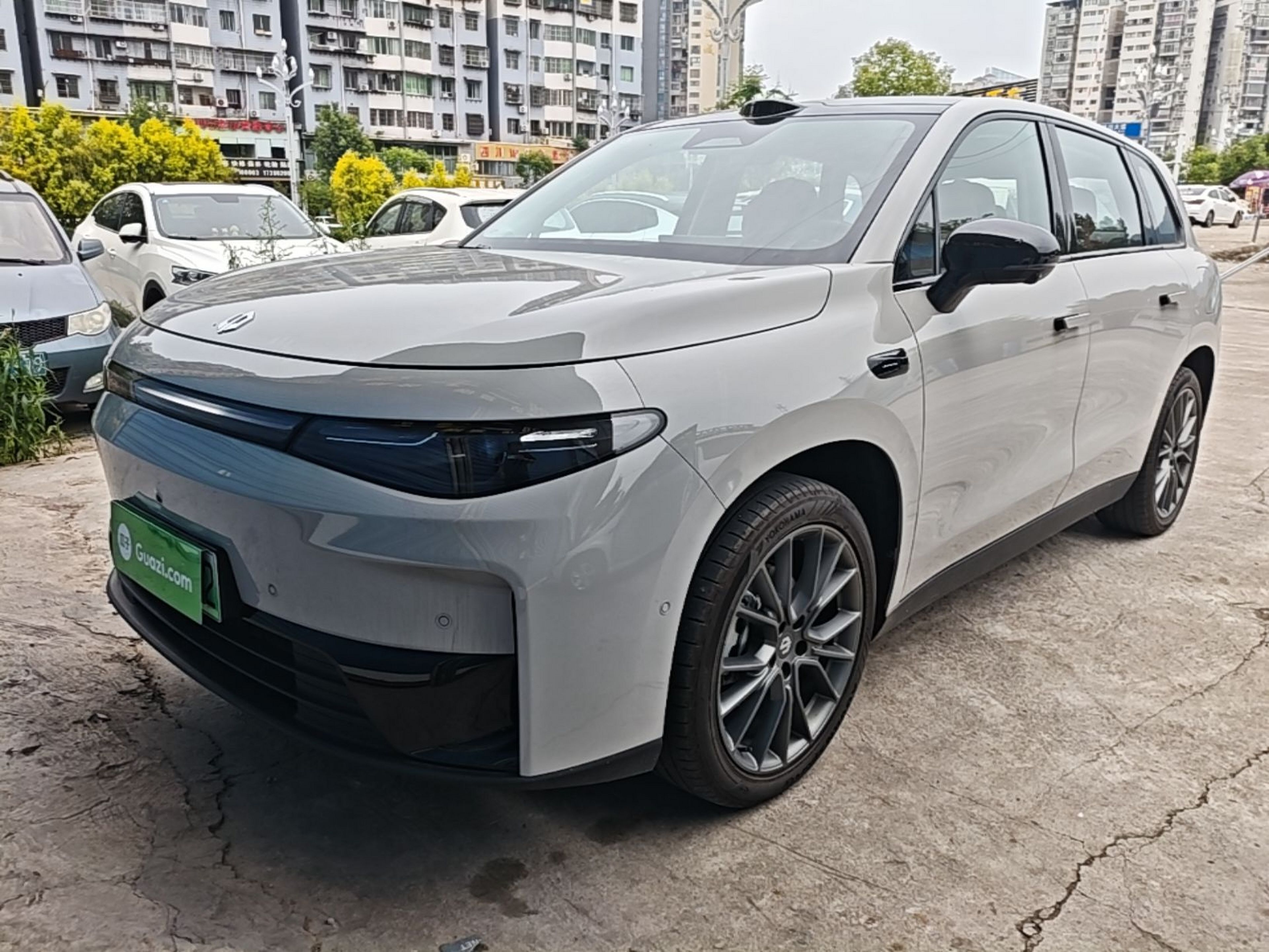 Under the front of the car